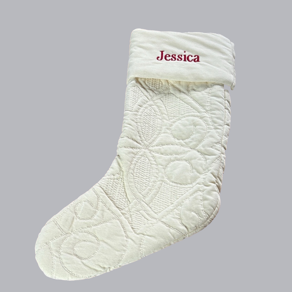 Pottery Barn cream colored quilted stocking with Jessica embroidered